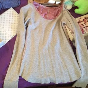 A long sleeve grey shirt with thumb holes!